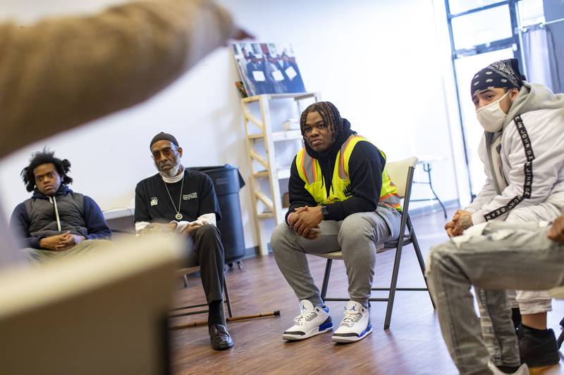 Kayode Martin, center, participates in a spiritual reflection group session at an Inner-City Muslim Action Network facility in Chicago Lawn on March 2, 2022. ©Brian Cassella / Chicago Tribune