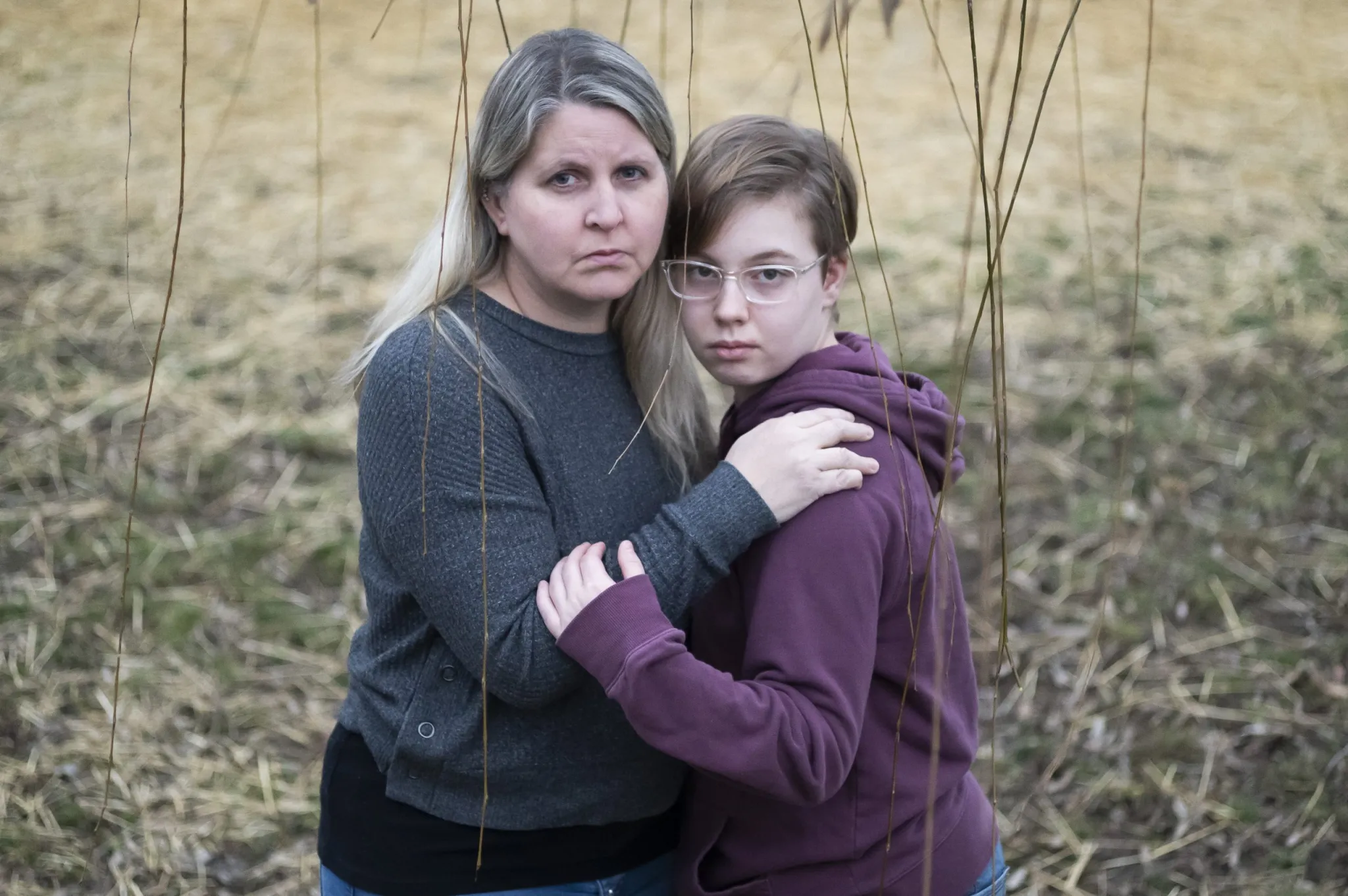 ©Joshua Bickel/Center for Public Integrity: Hannah Norris, 13, and her mother, Lisa Norris, pose for a portrait at their home, Dec. 10, 2022, in Hilliard, Ohio. 