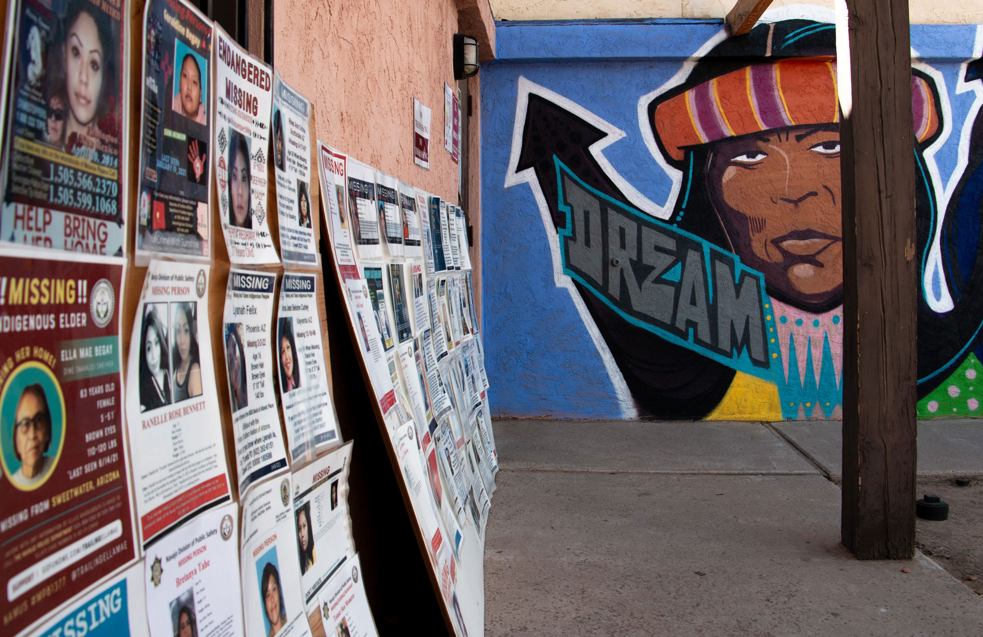 Posters of missing Indigenous people are displayed outside of Drumbeat Indian Arts in Phoenix on Sept. 28, 2023, where the advocacy group Stolen People, Stolen Benefits is based. ©Brendon Derr/AZCIR