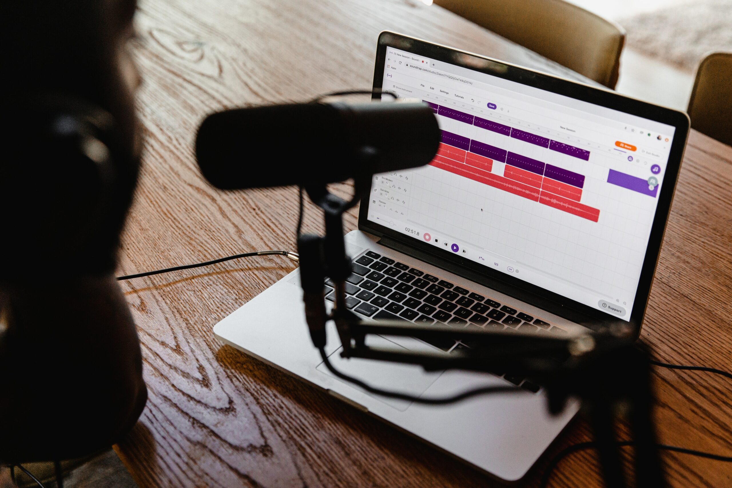 Image of a laptop and microphone.