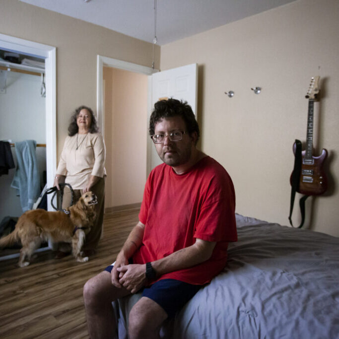 Noah and his mother, Kara Diamond, spend time together in his room at the John Henry Foundation in Santa Ana, with their dog Tucker. ©Jenna Schoenefeld for California Health Report/CatchLight 