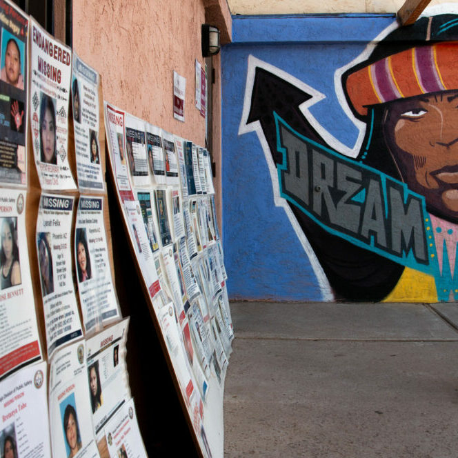 Posters of missing Indigenous people are displayed outside of Drumbeat Indian Arts in Phoenix on Sept. 28, 2023, where the advocacy group Stolen People, Stolen Benefits is based. ©Brendon Derr/AZCIR