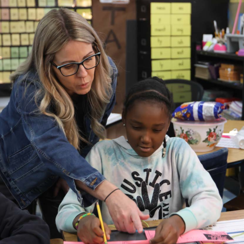 ©Navya Shukla/The Oglethorpe Echo: Katie Edwards, a counselor at Oglethorpe County Elementary School, helps third-grader Londyn Wilson with a work- sheet during a guidance lesson last month. The lessons are regularly held to guide students' empathy, emotion regulation, perseverance and more. 